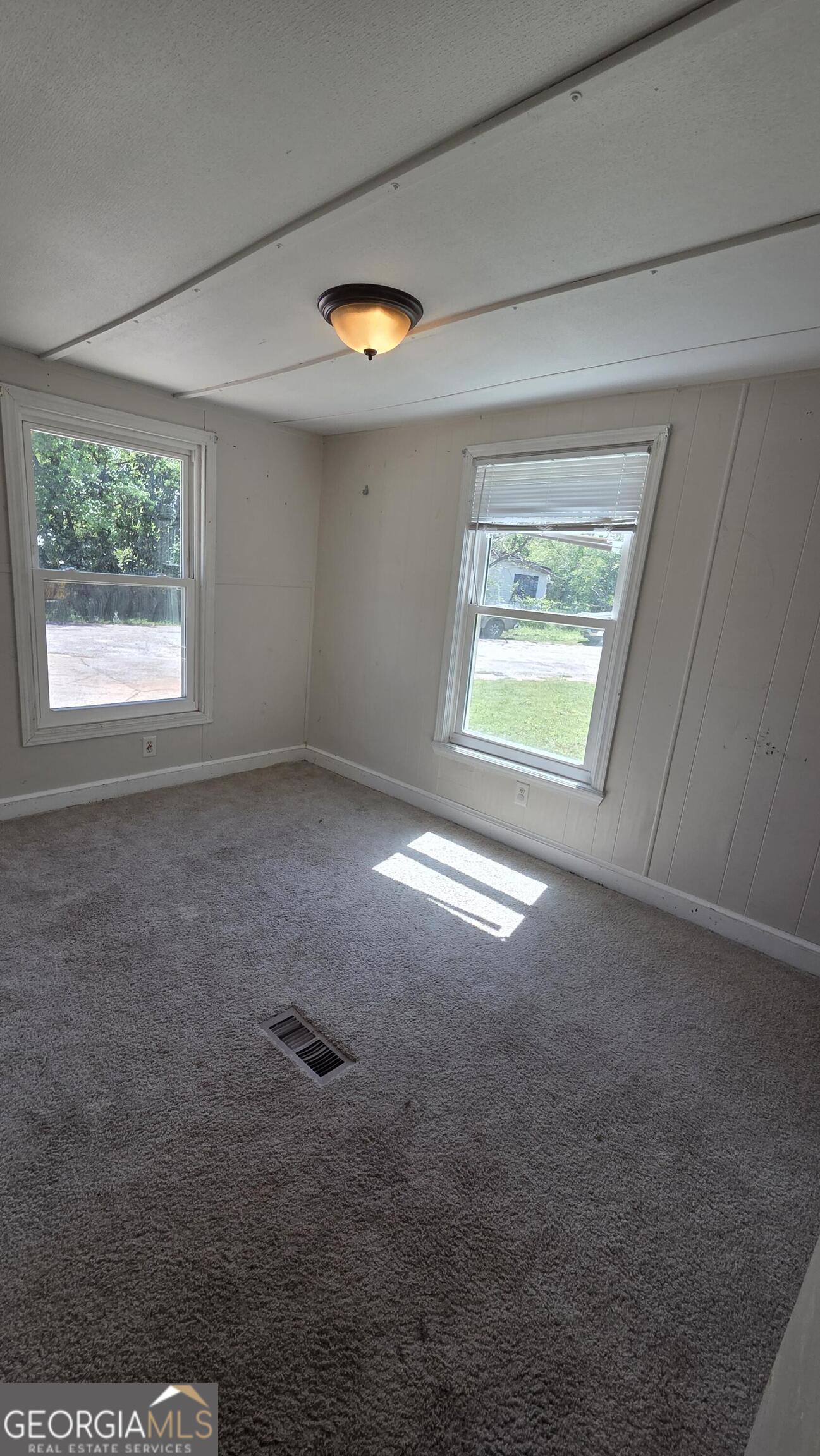25 Fischer Road Sharpsburg, GA 30277 - Photo 12 of 22 an empty room with windows