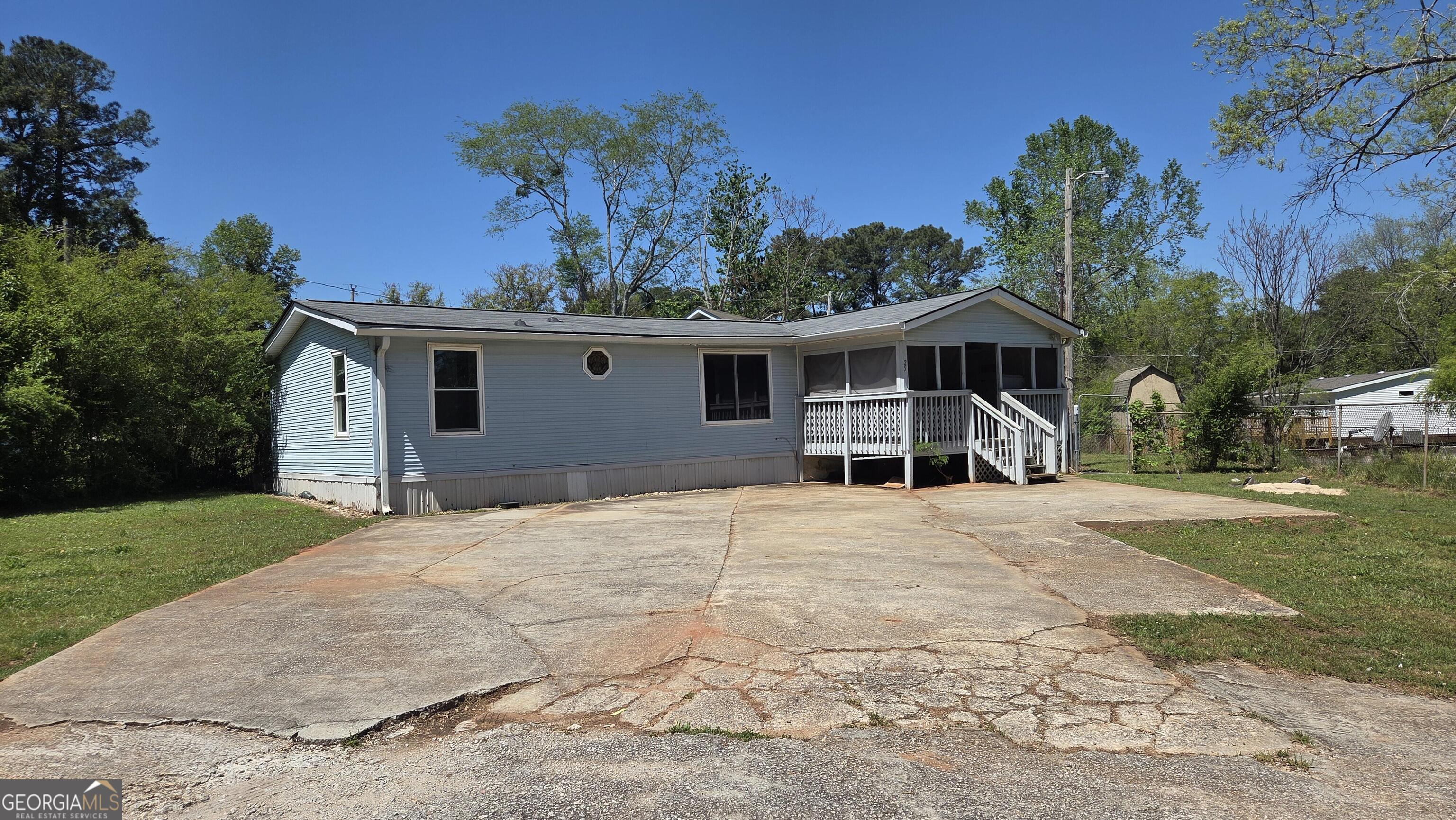 25 Fischer Road Sharpsburg, GA 30277 - Photo 2 of 22 a front view of a house with garden