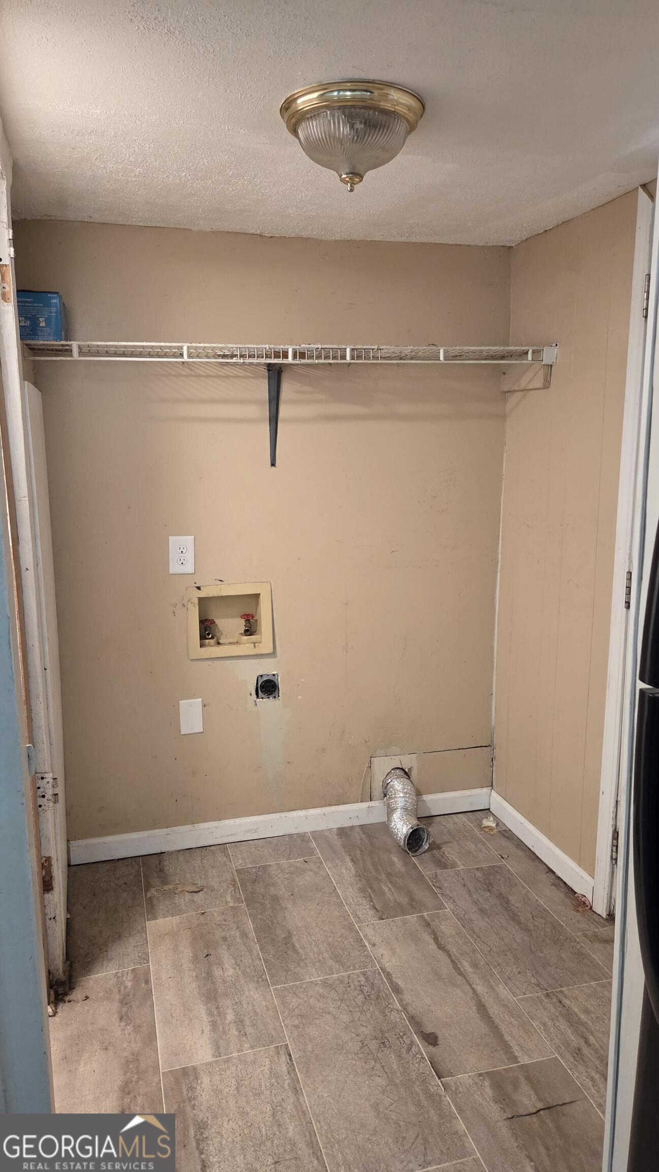 25 Fischer Road Sharpsburg, GA 30277 - Photo 4 of 22 a view of a room with racks on the wall