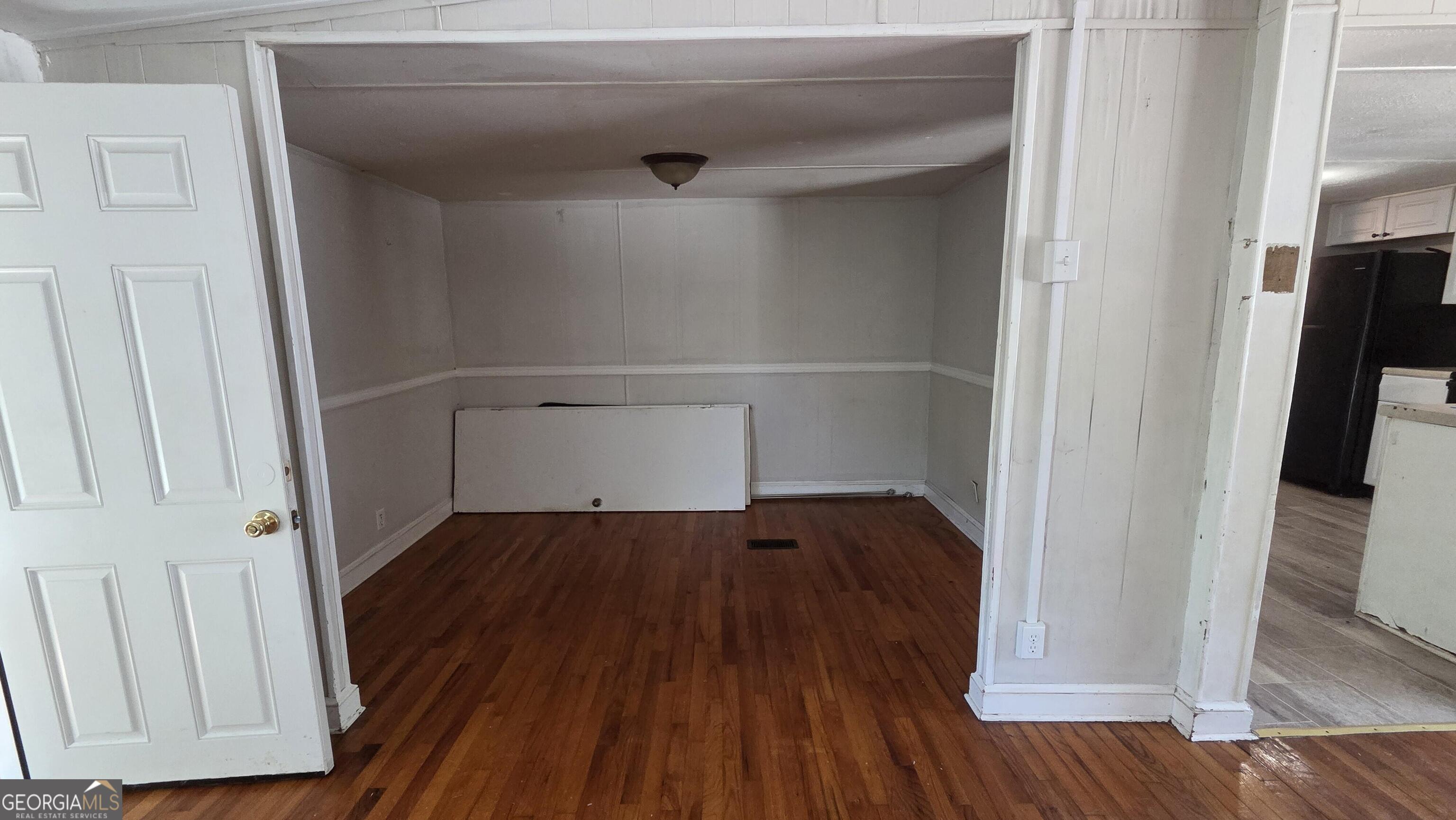 25 Fischer Road Sharpsburg, GA 30277 - Photo 7 of 22 a view of walk in closet with wooden floor