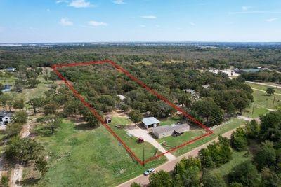 8055 County Road, Unit 301 Terrell, TX 75160 - Photo 4 of 8 an aerial view of a house with a yard