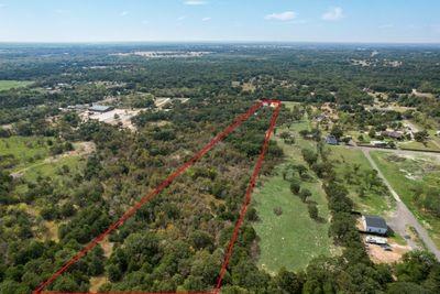 8055 County Road, Unit 301 Terrell, TX 75160 - Photo 7 of 8 an aerial view of residential houses with outdoor space and trees