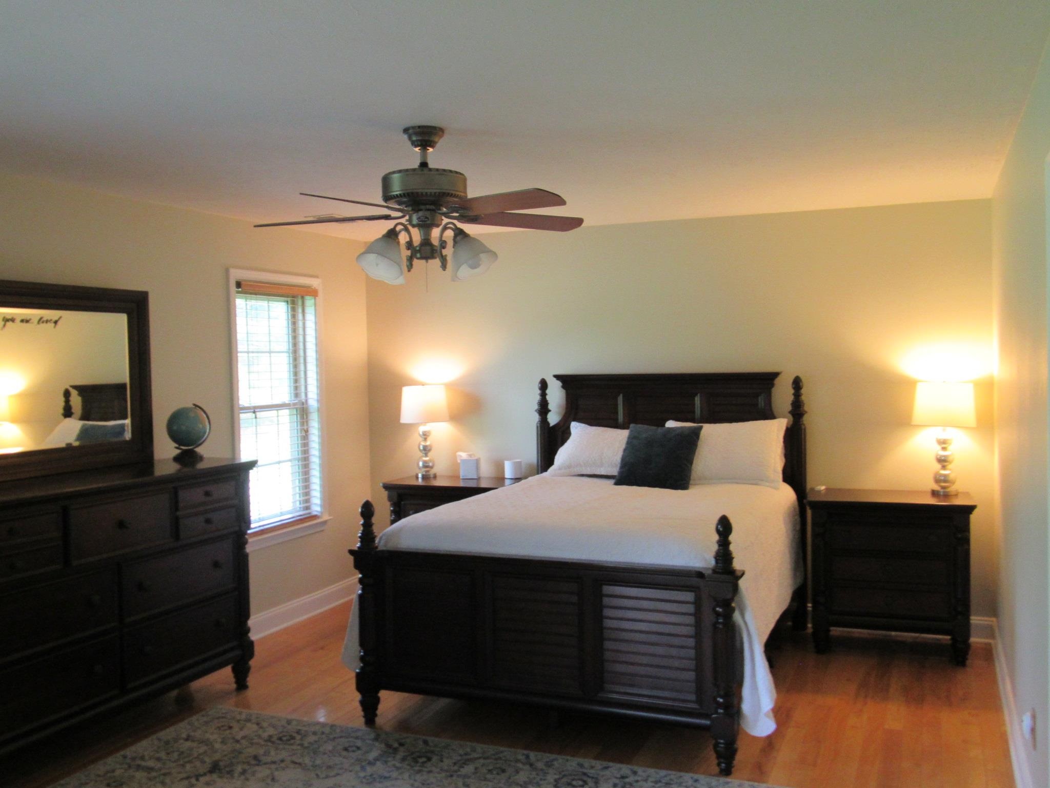 498 McQuiston Road Brighton, TN 38011 - Photo 14 of 17 a bedroom with a bed and a chandelier