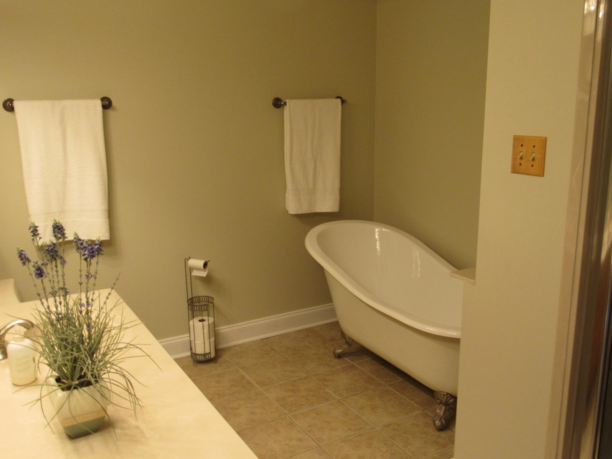 498 McQuiston Road Brighton, TN 38011 - Photo 15 of 17 a bathroom with a granite countertop sink and a mirror