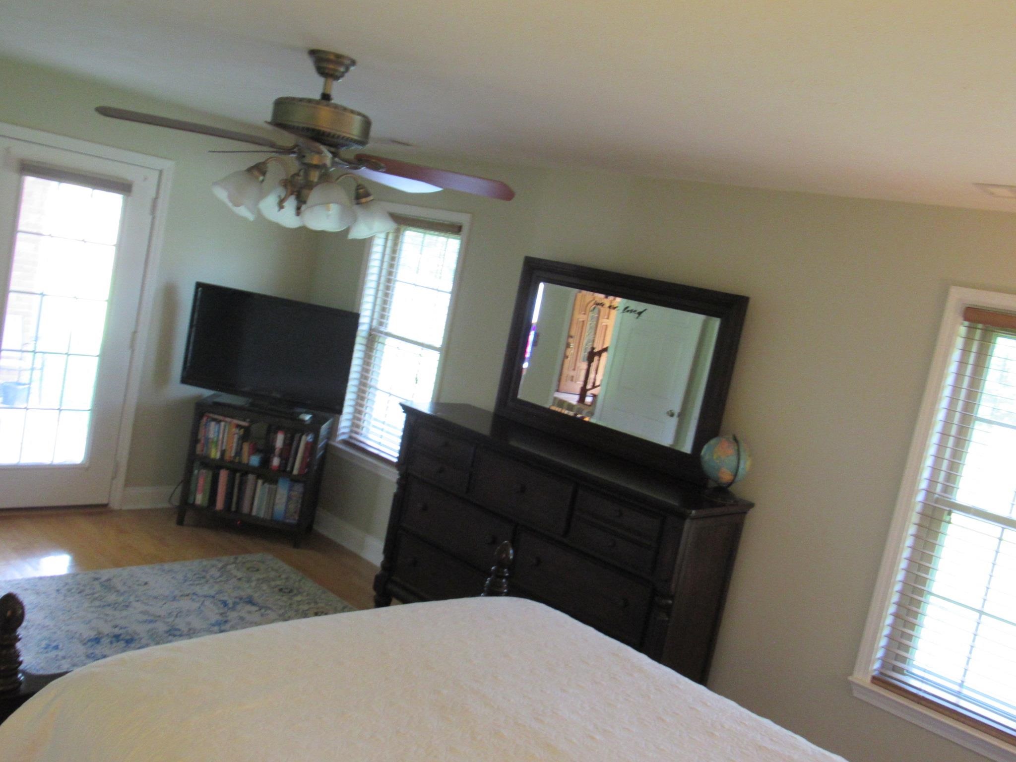 498 McQuiston Road Brighton, TN 38011 - Photo 16 of 17 a bedroom with a bed and a flat screen tv