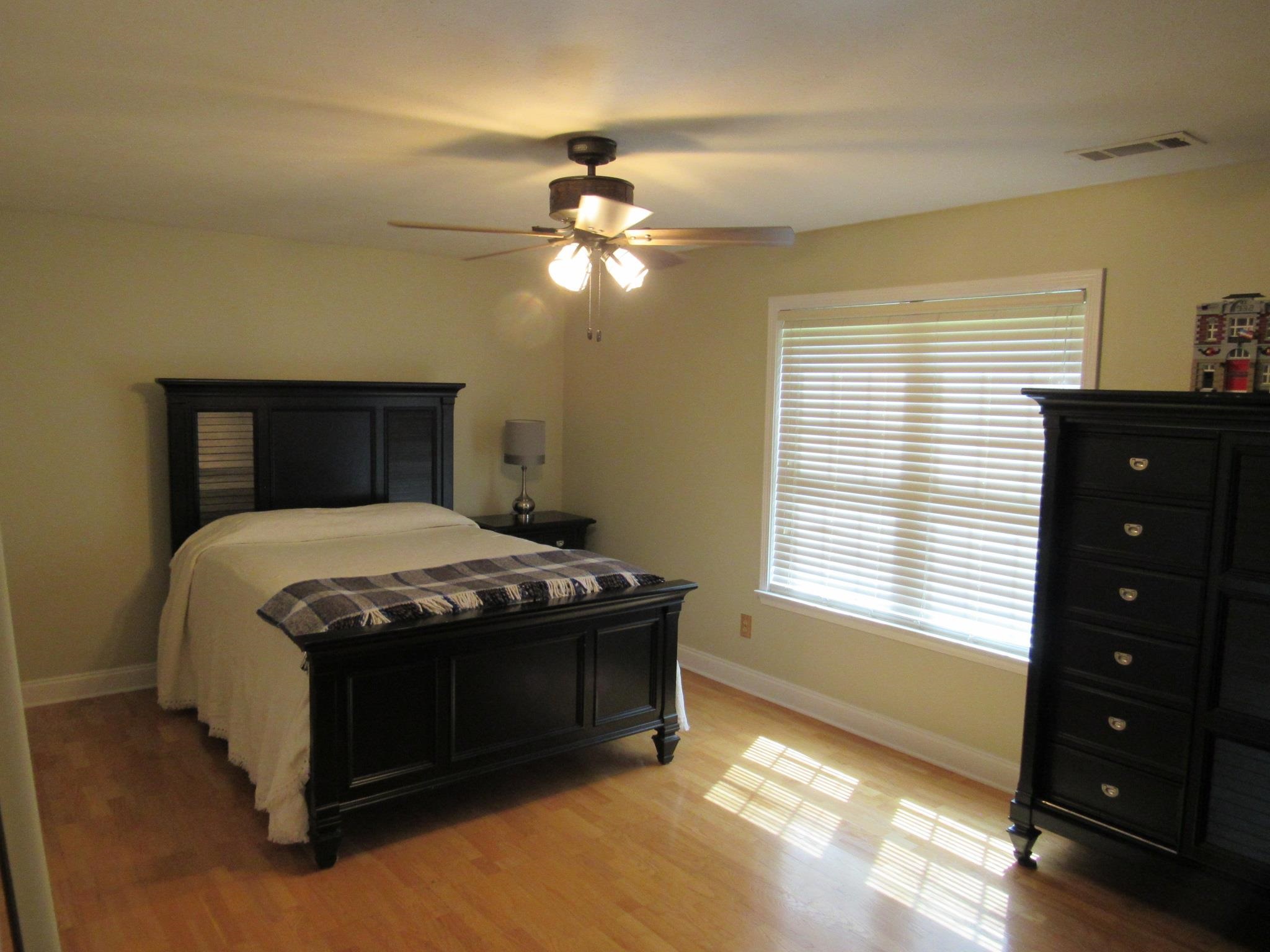 498 McQuiston Road Brighton, TN 38011 - Photo 2 of 17 a bedroom with a bed and a window