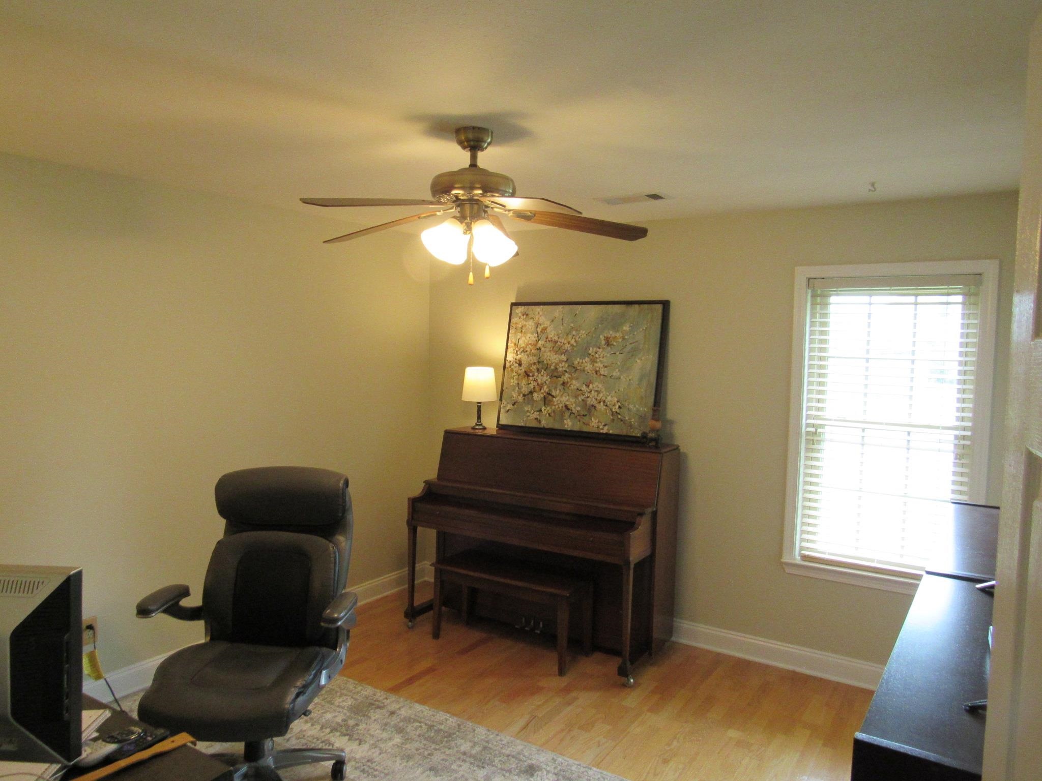 498 McQuiston Road Brighton, TN 38011 - Photo 3 of 17 a living room with furniture and a window