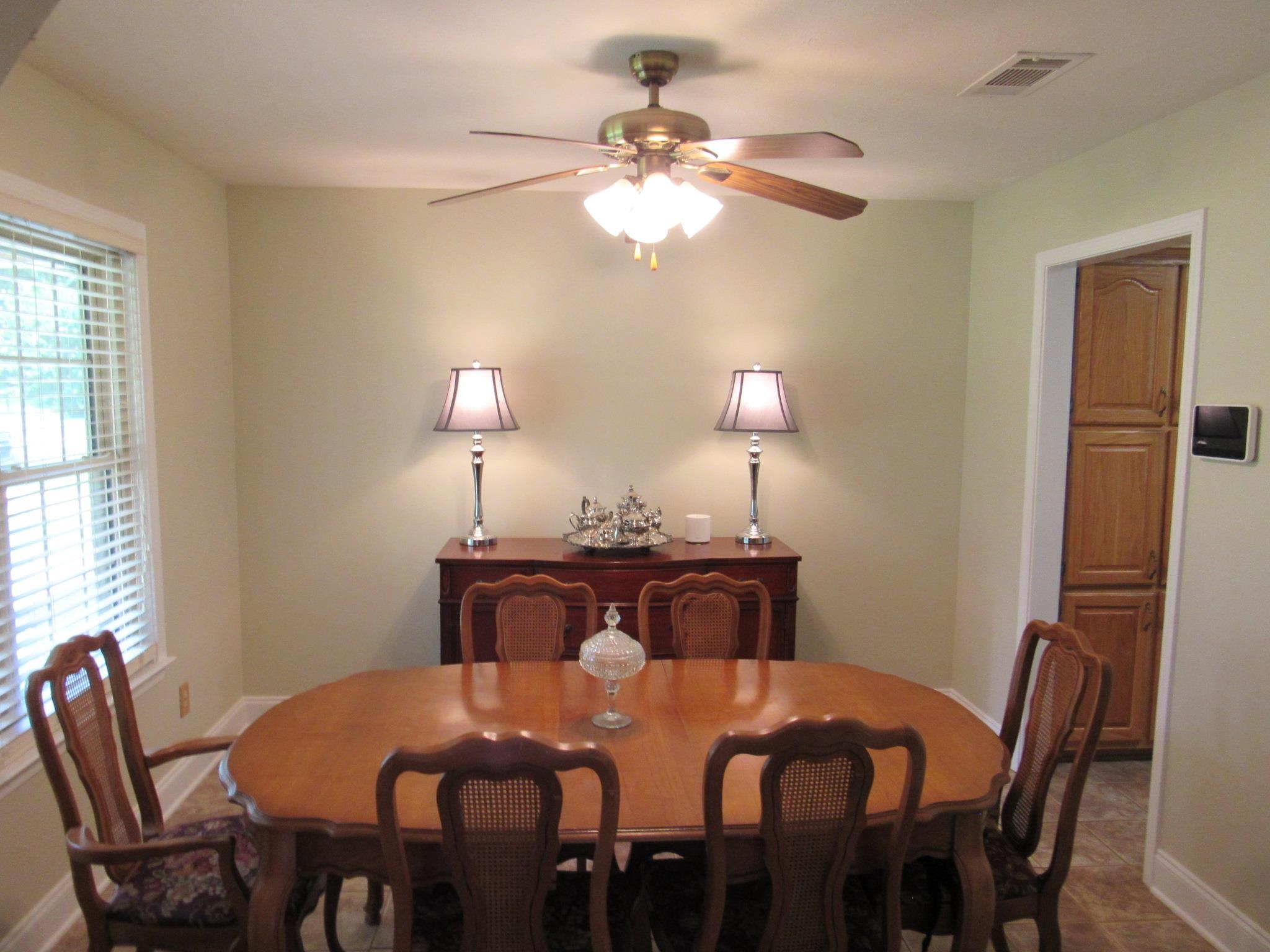 498 McQuiston Road Brighton, TN 38011 - Photo 6 of 17 a view of a dining room with furniture and chandelier