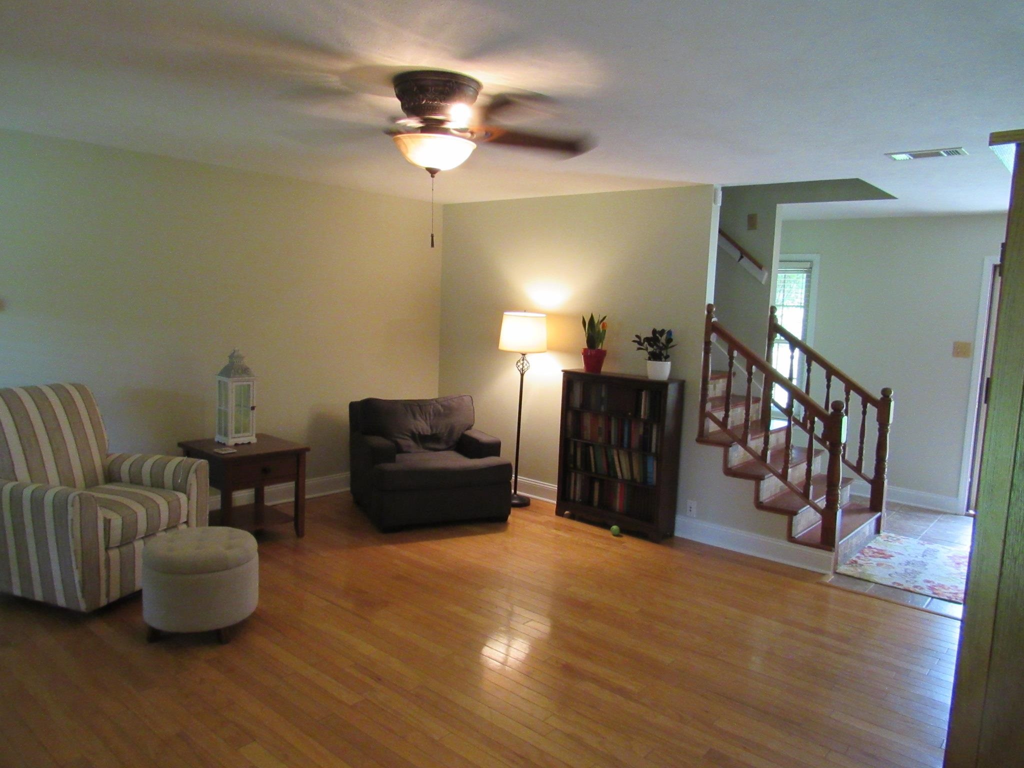 498 McQuiston Road Brighton, TN 38011 - Photo 9 of 17 a living room with furniture and a wooden floor