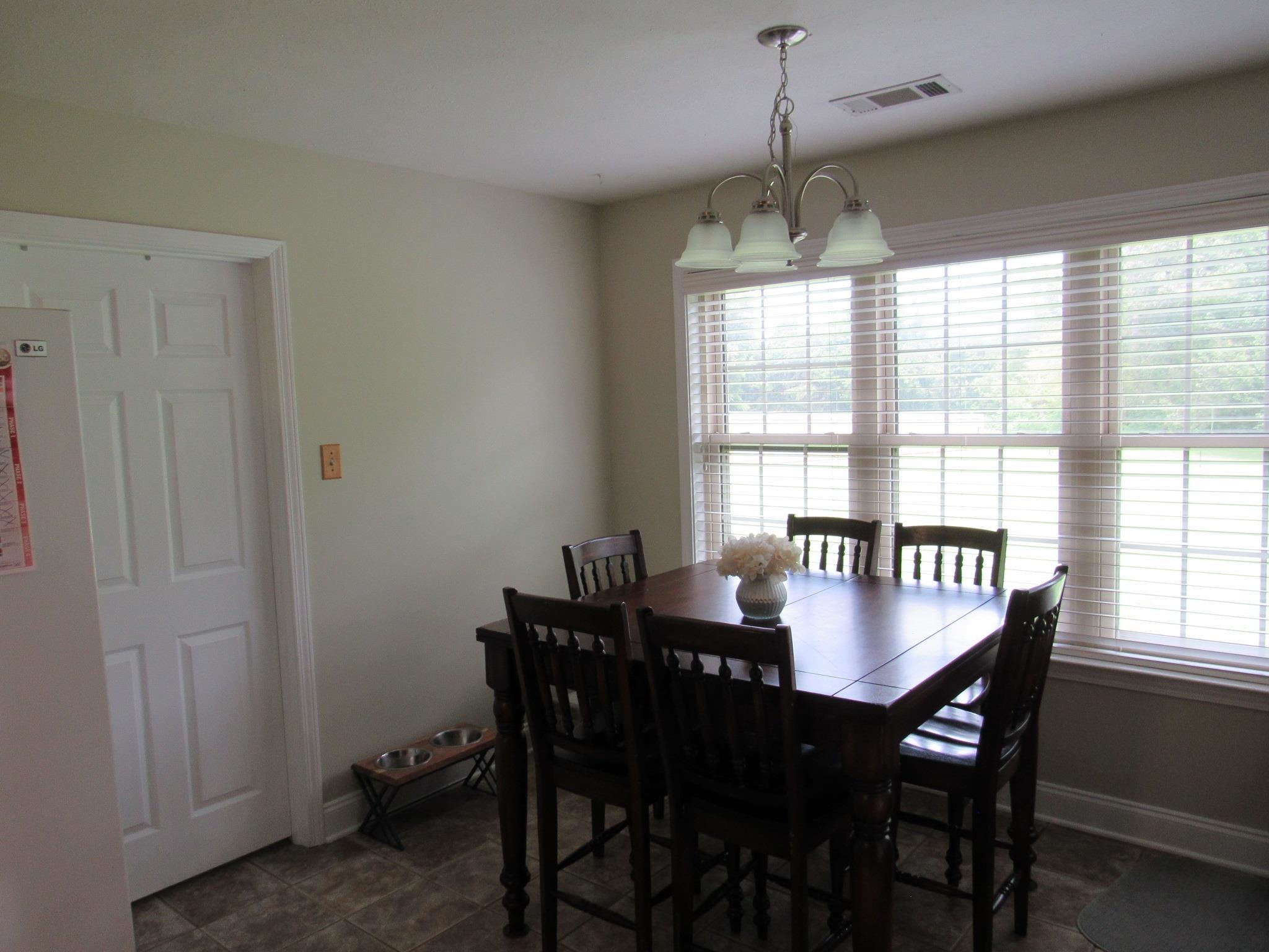 498 McQuiston Road Brighton, TN 38011 - Photo 10 of 17 a view of a dining room with furniture and window