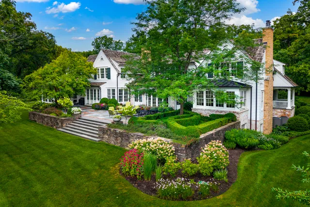 a bedroom with a bed couch and window
