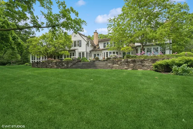 a bathroom with a tub sink and window