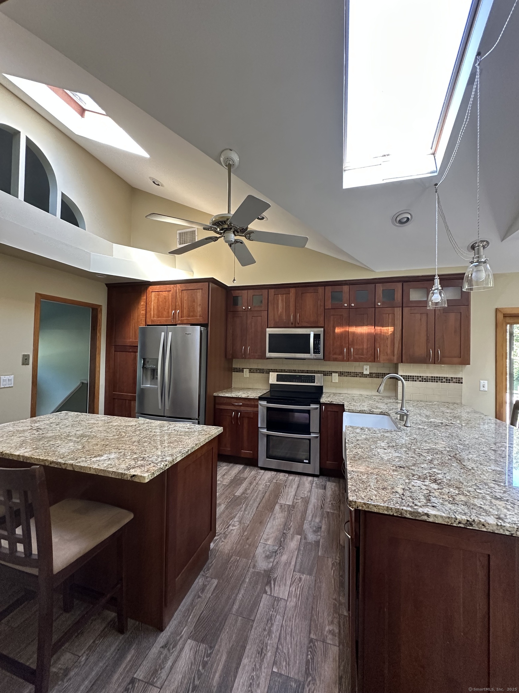 80 Woodlawn Road Monroe, CT 06468 - Photo 15 of 40 a kitchen with kitchen island a sink appliances and cabinets