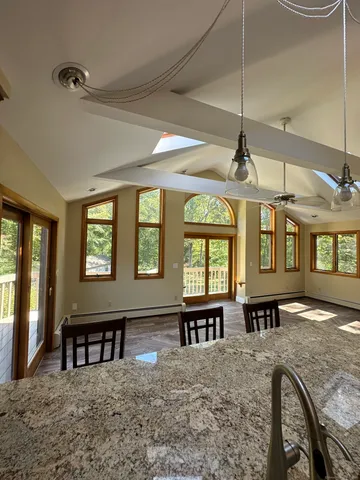 a view of a livingroom with furniture window and wooden floor