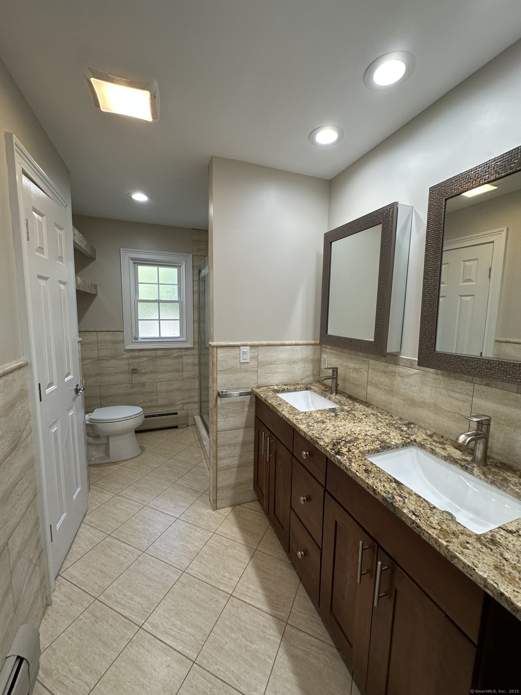 80 Woodlawn Road Monroe, CT 06468 - Photo 21 of 40 a spacious bathroom with a granite countertop sink and a mirror
