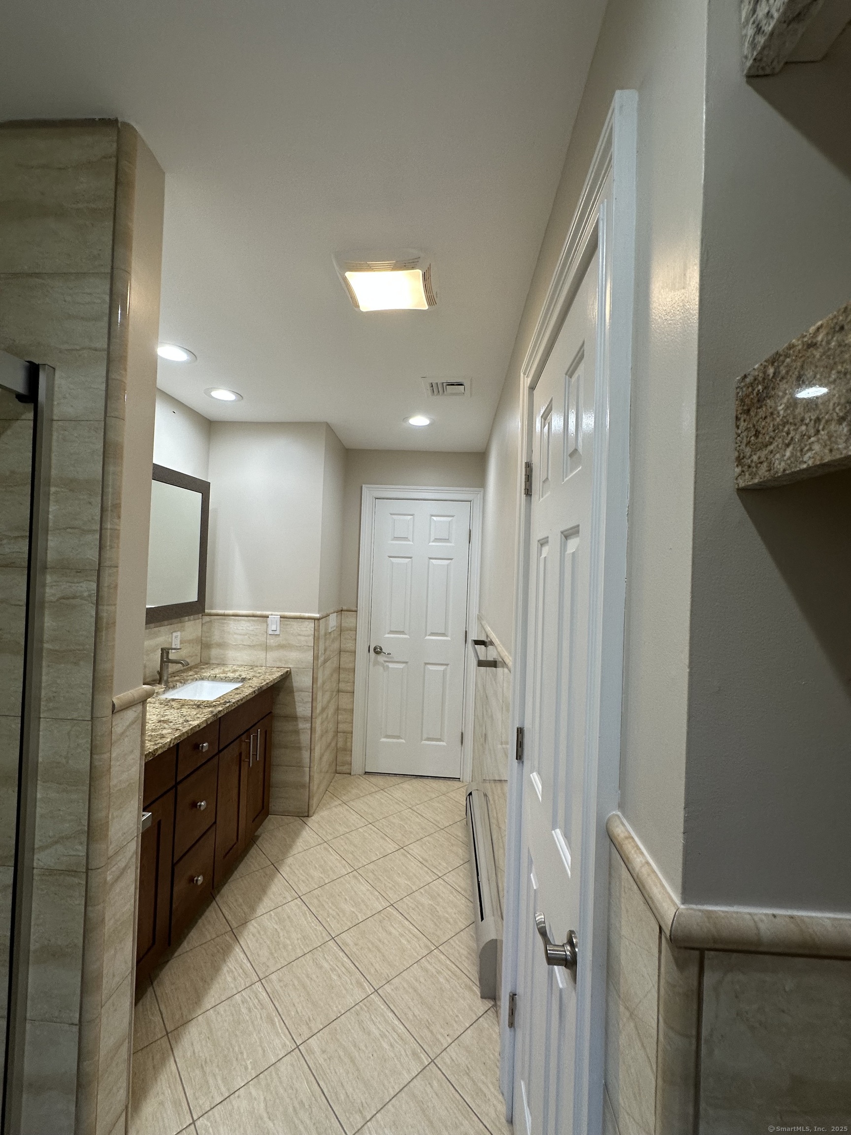 80 Woodlawn Road Monroe, CT 06468 - Photo 26 of 40 a large bathroom with a large mirror vanity and a sink