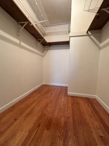 a white toilet sitting next to a white sink