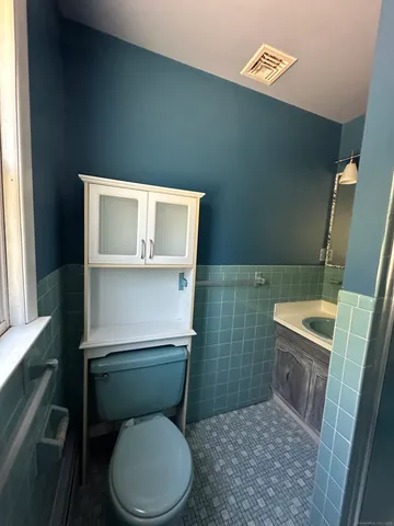 a bedroom with bed and window