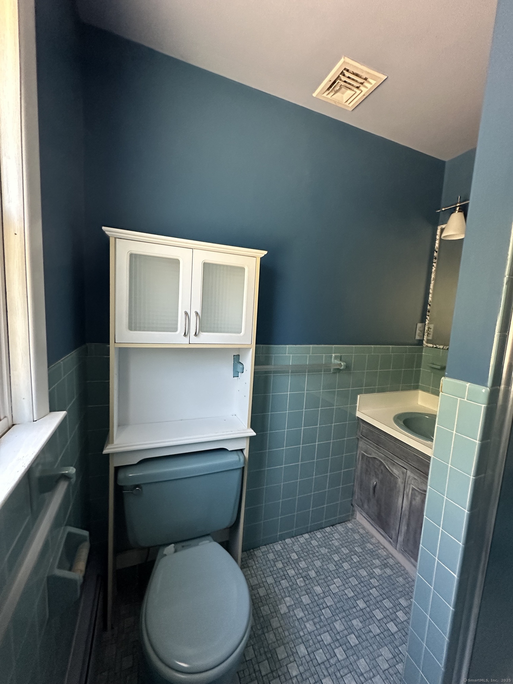 80 Woodlawn Road Monroe, CT 06468 - Photo 29 of 40 a white toilet sitting next to a white sink