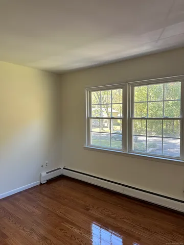 an empty room with a bench