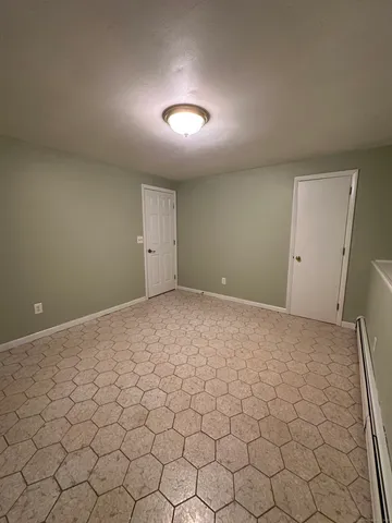 a view of a hallway with an empty room