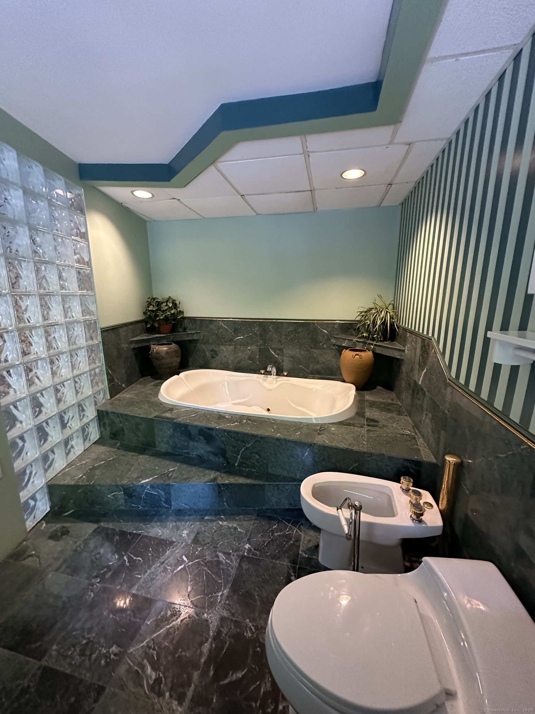 80 Woodlawn Road Monroe, CT 06468 - Photo 37 of 40 a bathroom with a toilet sink and mirror