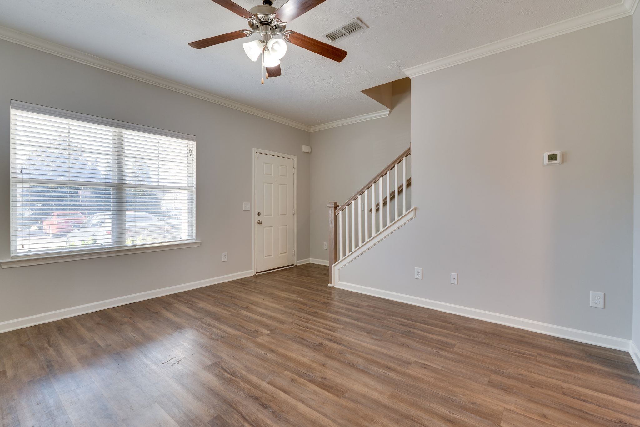 810 Staten Drive Murfreesboro, TN 37128 - Photo 6 of 20 a view of an empty room with wooden floor and a window
