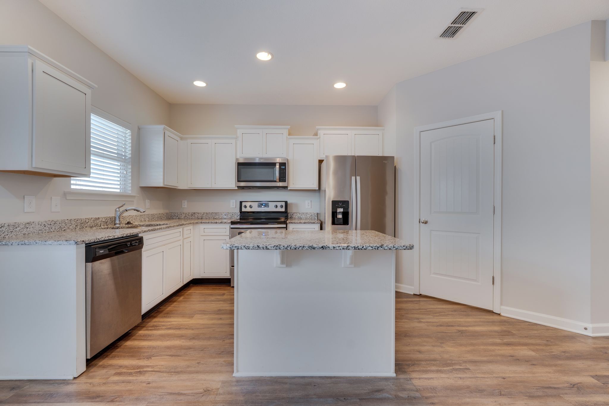 810 Staten Drive Murfreesboro, TN 37128 - Photo 8 of 20 a kitchen with kitchen island a white cabinets and refrigerator