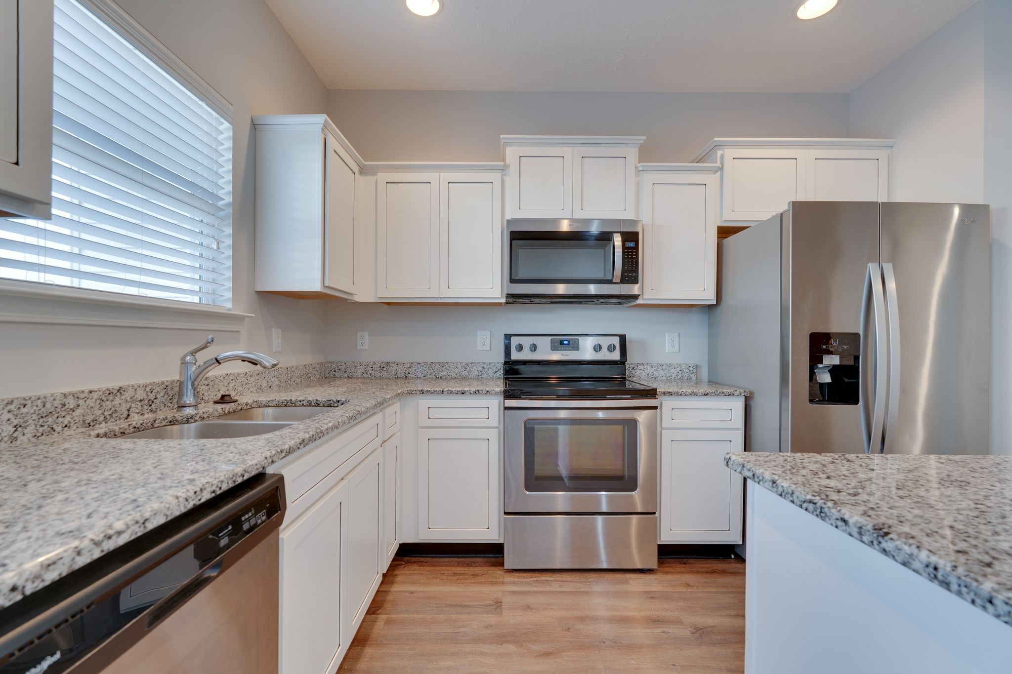 810 Staten Drive Murfreesboro, TN 37128 - Photo 9 of 20 a kitchen with stainless steel appliances granite countertop a sink stove microwave and refrigerator