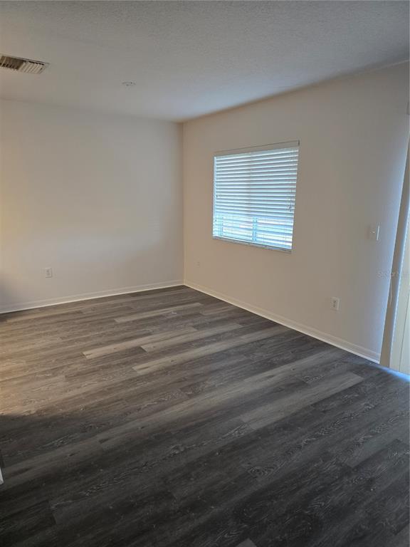 13126 Fennway Ridge Drive Riverview, FL 33579 - Photo 3 of 10 a view of an empty room with wooden floor and a window