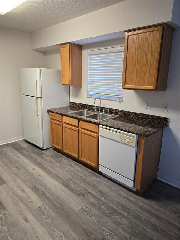 13126 Fennway Ridge Drive Riverview, FL 33579 - Photo 4 of 10 a kitchen with stainless steel appliances granite countertop a sink stove and refrigerator
