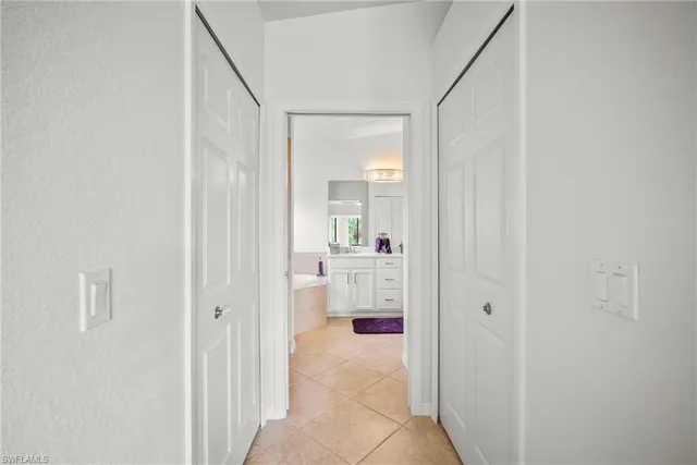 a bathroom with a tub and mirror