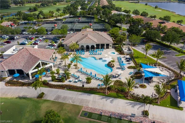 an aerial view of multiple houses with yard