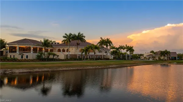a front view of a house with a lake view