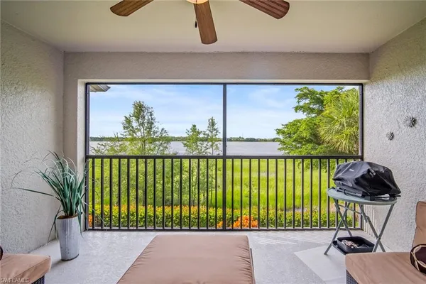 a view of a porch and a floor to ceiling window