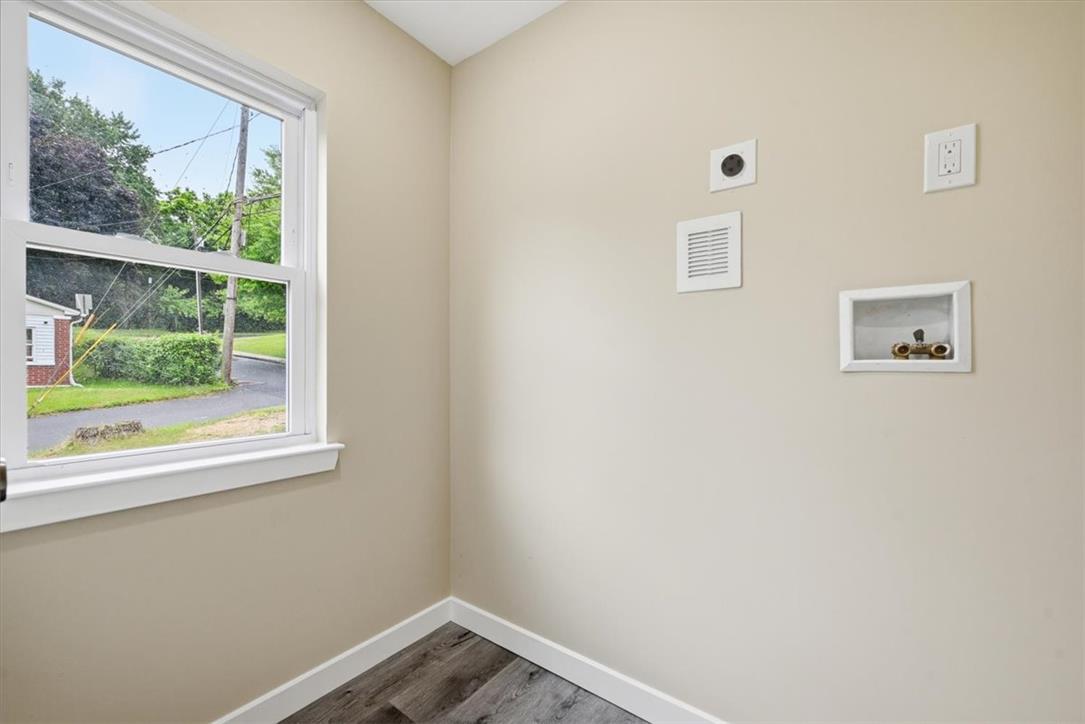 5641 North Coplay Road Whitehall, PA 18052 - Photo 39 of 68 Ready for appliances, this utility room features durable flooring and a bright window view.