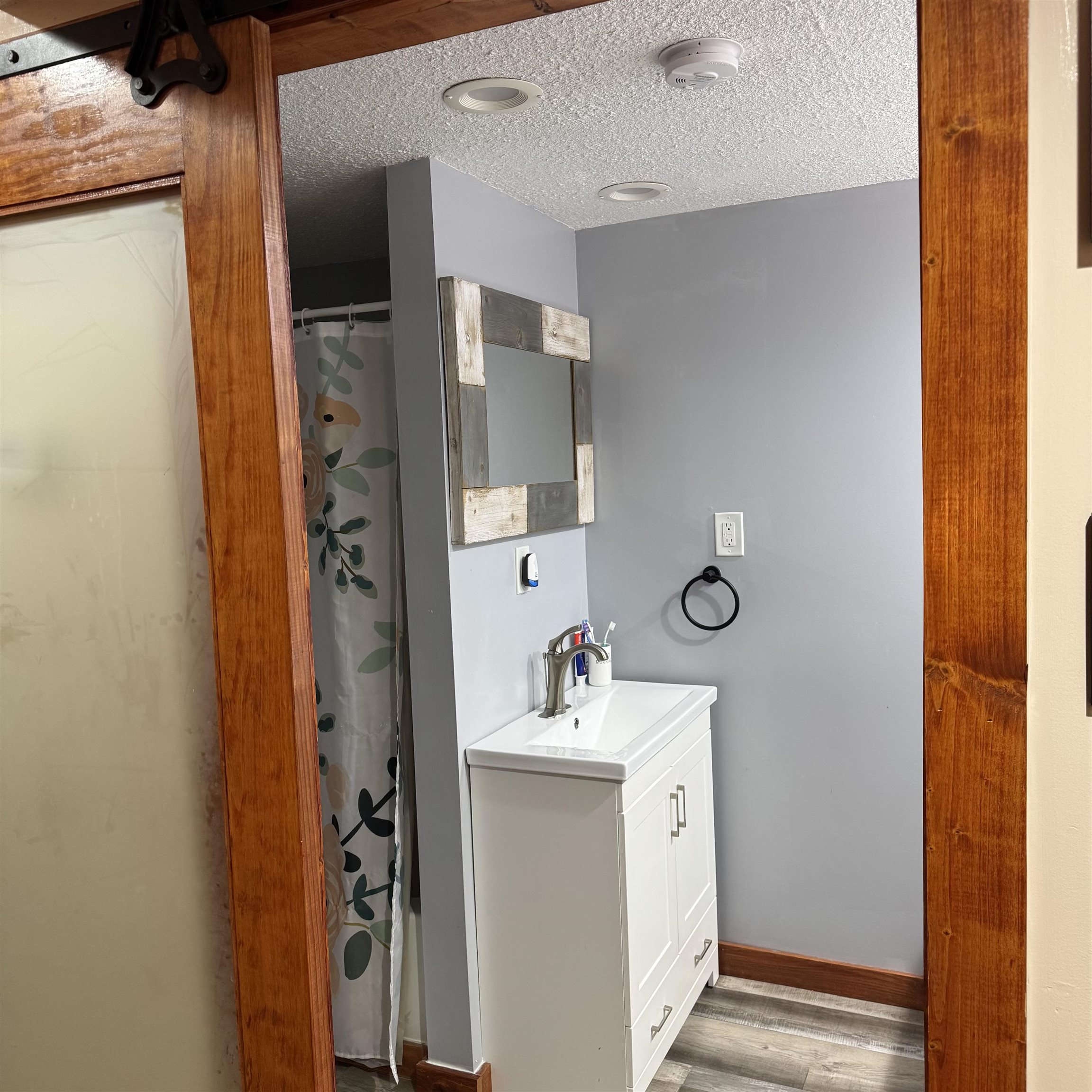 342 West Front Avenue Stockton, IL 61085 - Photo 16 of 21 a bathroom with a sink and a mirror