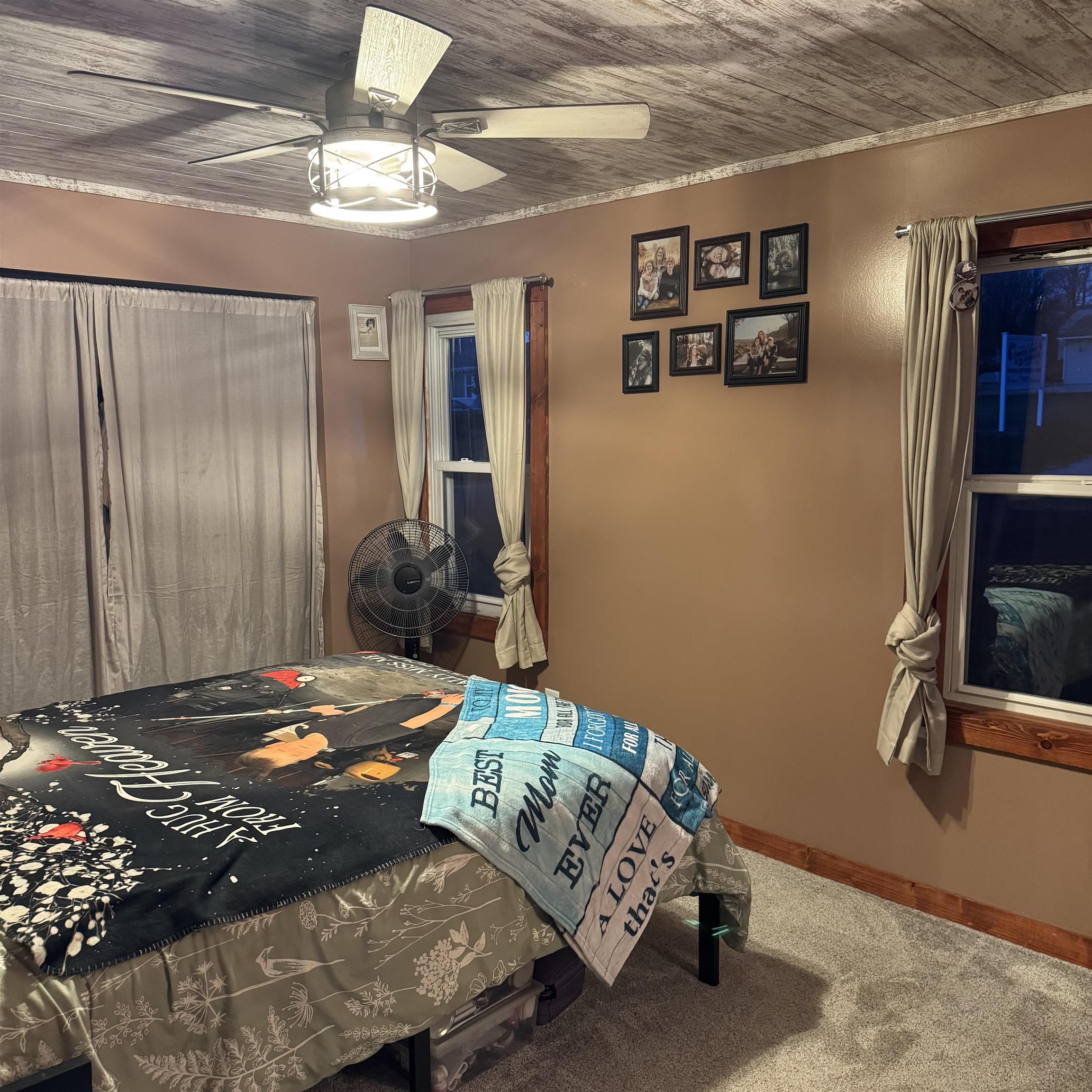 342 West Front Avenue Stockton, IL 61085 - Photo 9 of 21 a bedroom with a bed and a chandelier