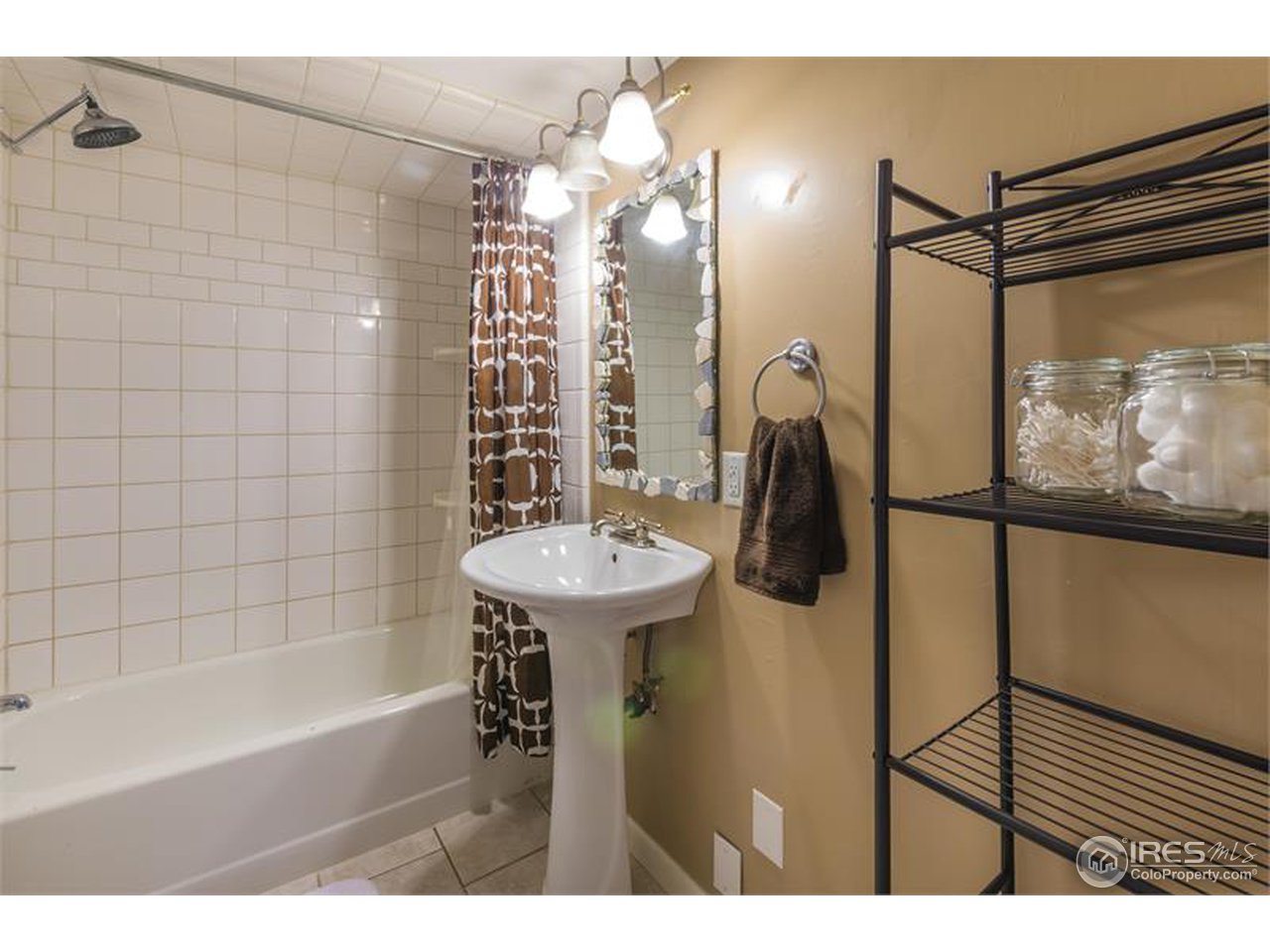 711 East Baseline Road Lafayette, CO 80026 - Photo 12 of 21 a bathroom with a sink bath tub and shower