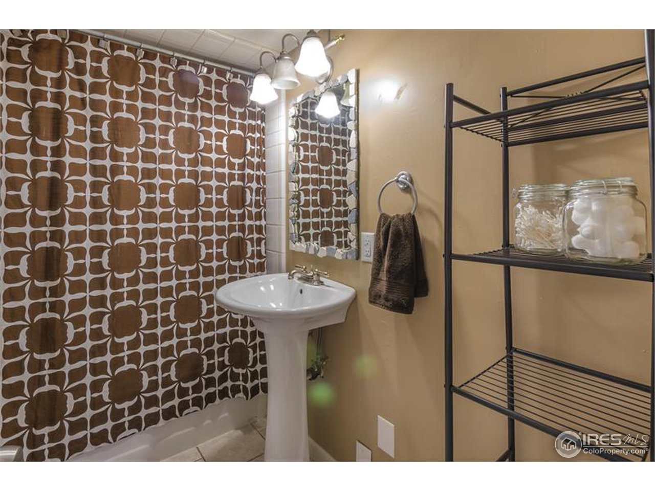 711 East Baseline Road Lafayette, CO 80026 - Photo 13 of 21 a bathroom with a sink and mirror
