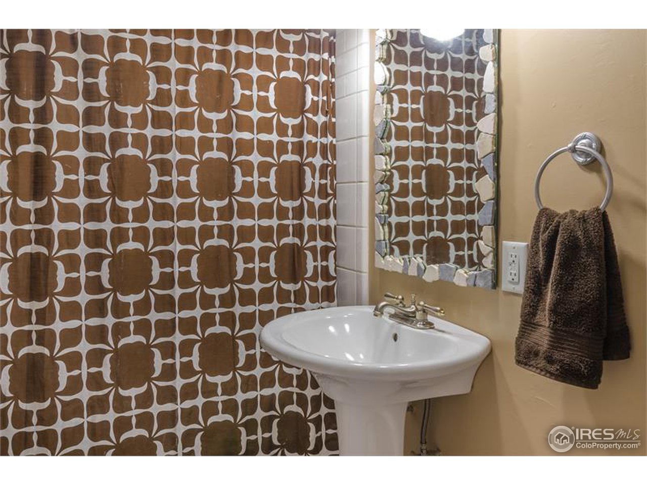 711 East Baseline Road Lafayette, CO 80026 - Photo 14 of 21 a bathroom with a sink and a mirror