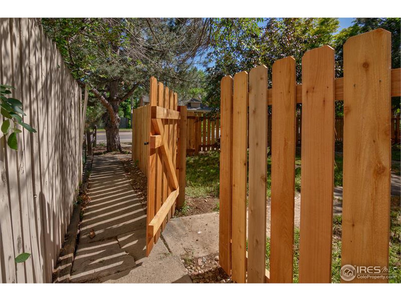 711 East Baseline Road Lafayette, CO 80026 - Photo 19 of 21 a view of a house with a wooden fence