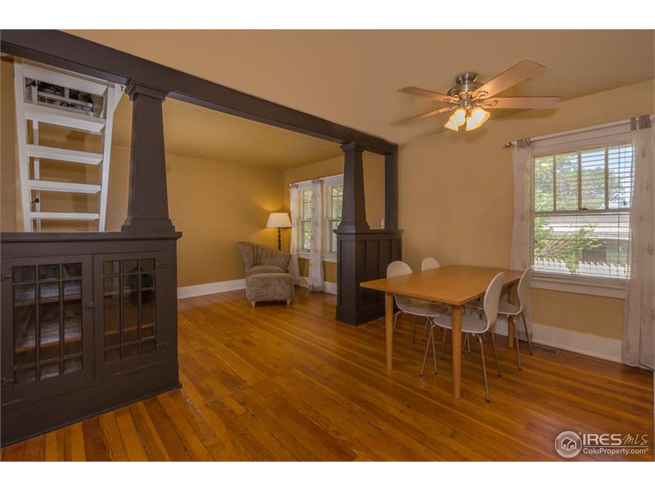 711 East Baseline Road Lafayette, CO 80026 - Photo 7 of 21 a living room with furniture and a wooden floor