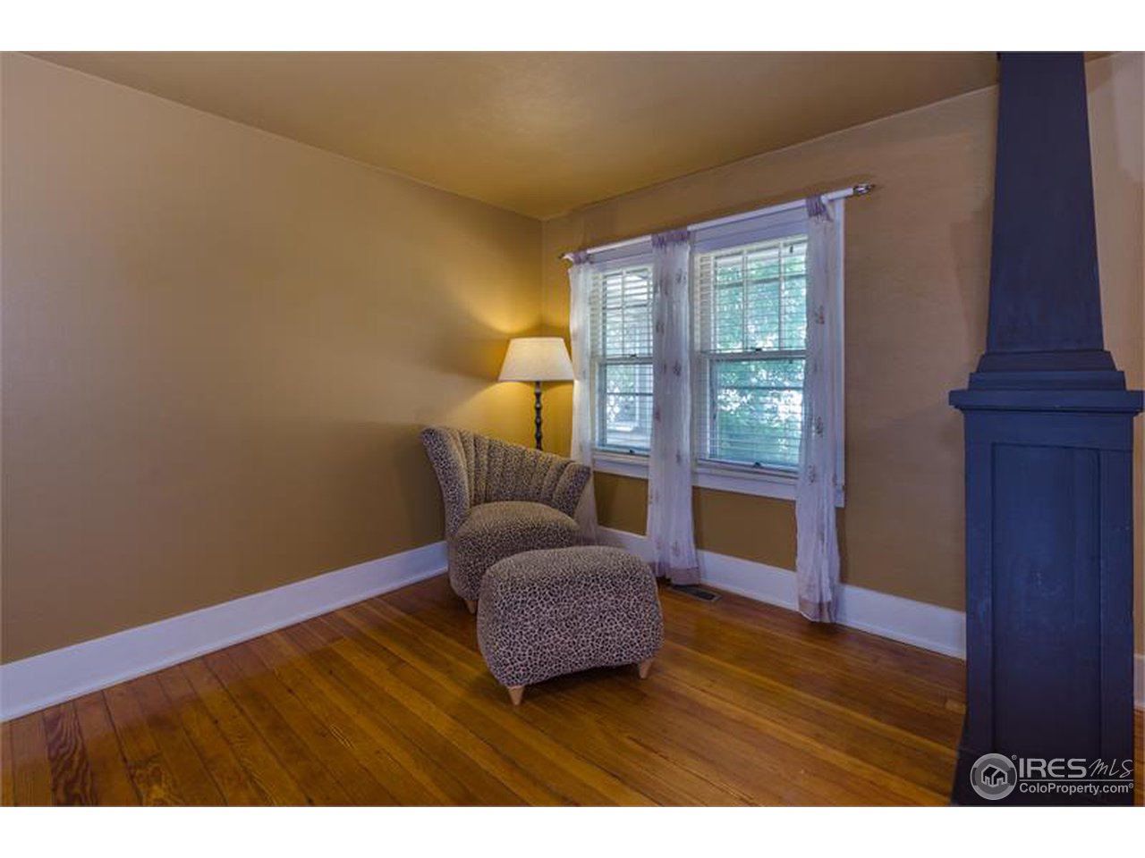 711 East Baseline Road Lafayette, CO 80026 - Photo 8 of 21 a living room with furniture and a window