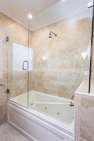 a bathroom with a bathtub and a shower