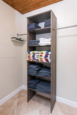 a bedroom with bed and window