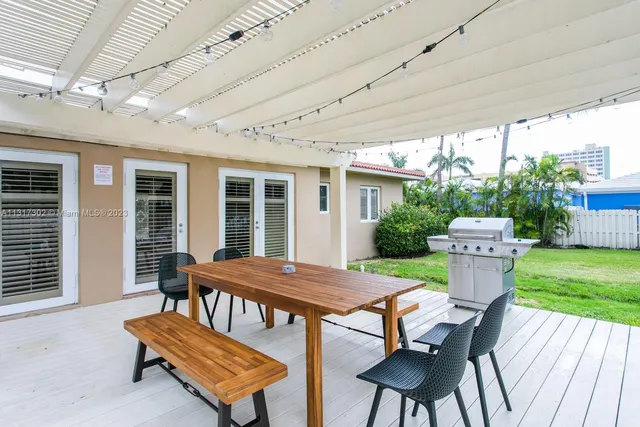 a table and chairs in front of a house