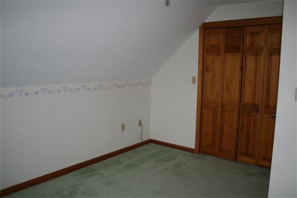 91 Spring Street Fairhaven, MA 02719 - Photo 25 of 30 an empty room with a wooden door