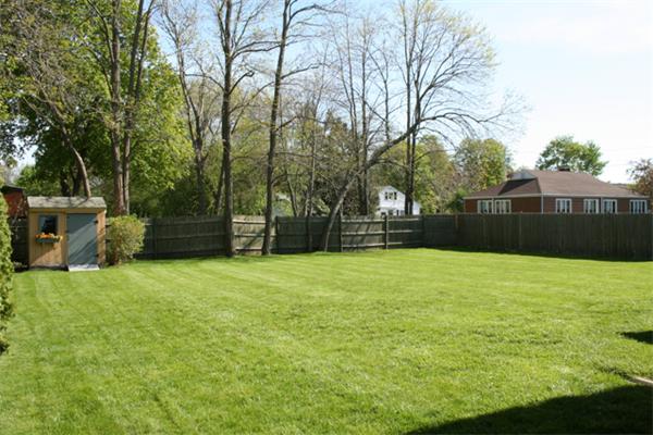 91 Spring Street Fairhaven, MA 02719 - Photo 3 of 30 a backyard of a house with lots of green space