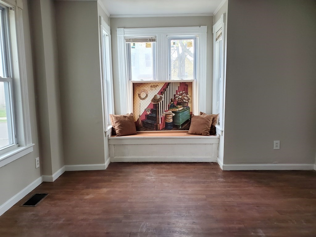 80-84 Keith Street Springfield, MA 01108 - Photo 1 of 4 a spacious bedroom with a bed and a window